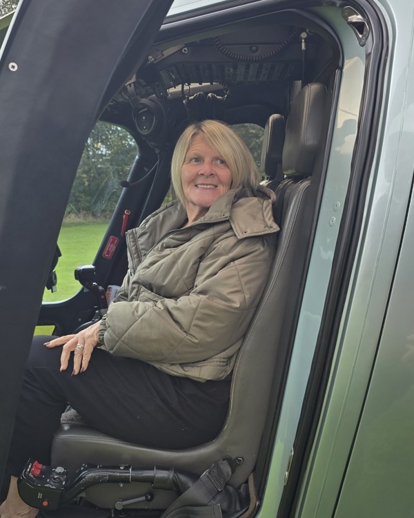 The Manor Events Manager Becky in the cockpit of a helicopter.