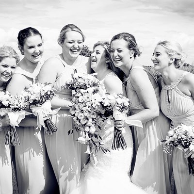 The bride & her bridesmaids enjoying themselves on the marquee lawn