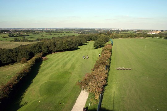 Tees on the 10th hole from above with driving range on the right