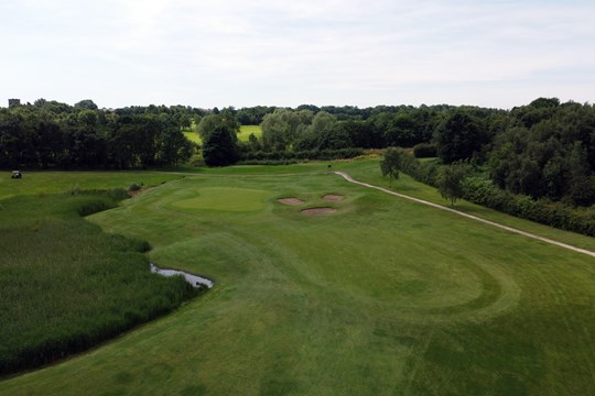 view of 4th green and lake