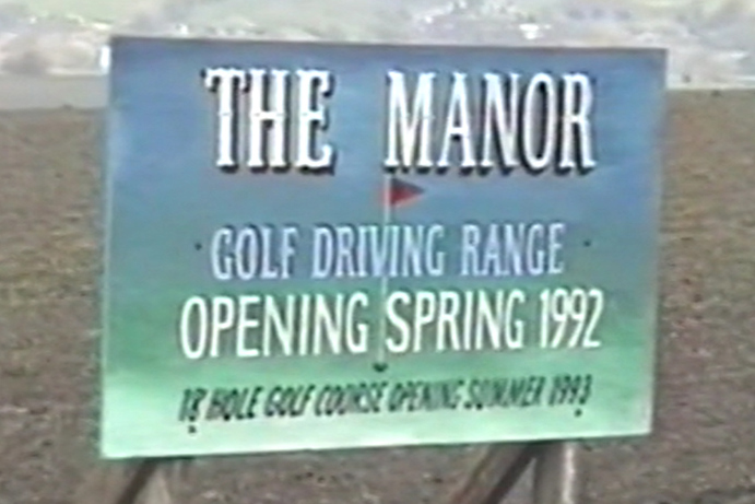 A sign announcing the opening of The Manor driving range in spring 1992.