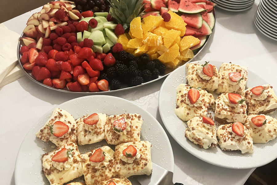 Fruit platter and cheesecakes on a buffet table at The Manor Leeds.