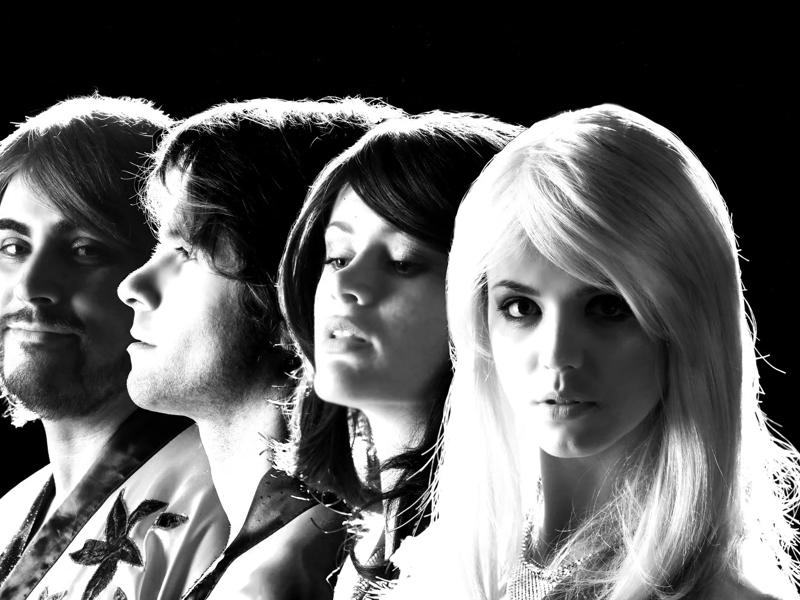 A black and white photo of ABBA tribute act Planet ABBA.