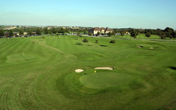 View of the Par 3 Academy Course at The Manor Leeds, with main building in the background.