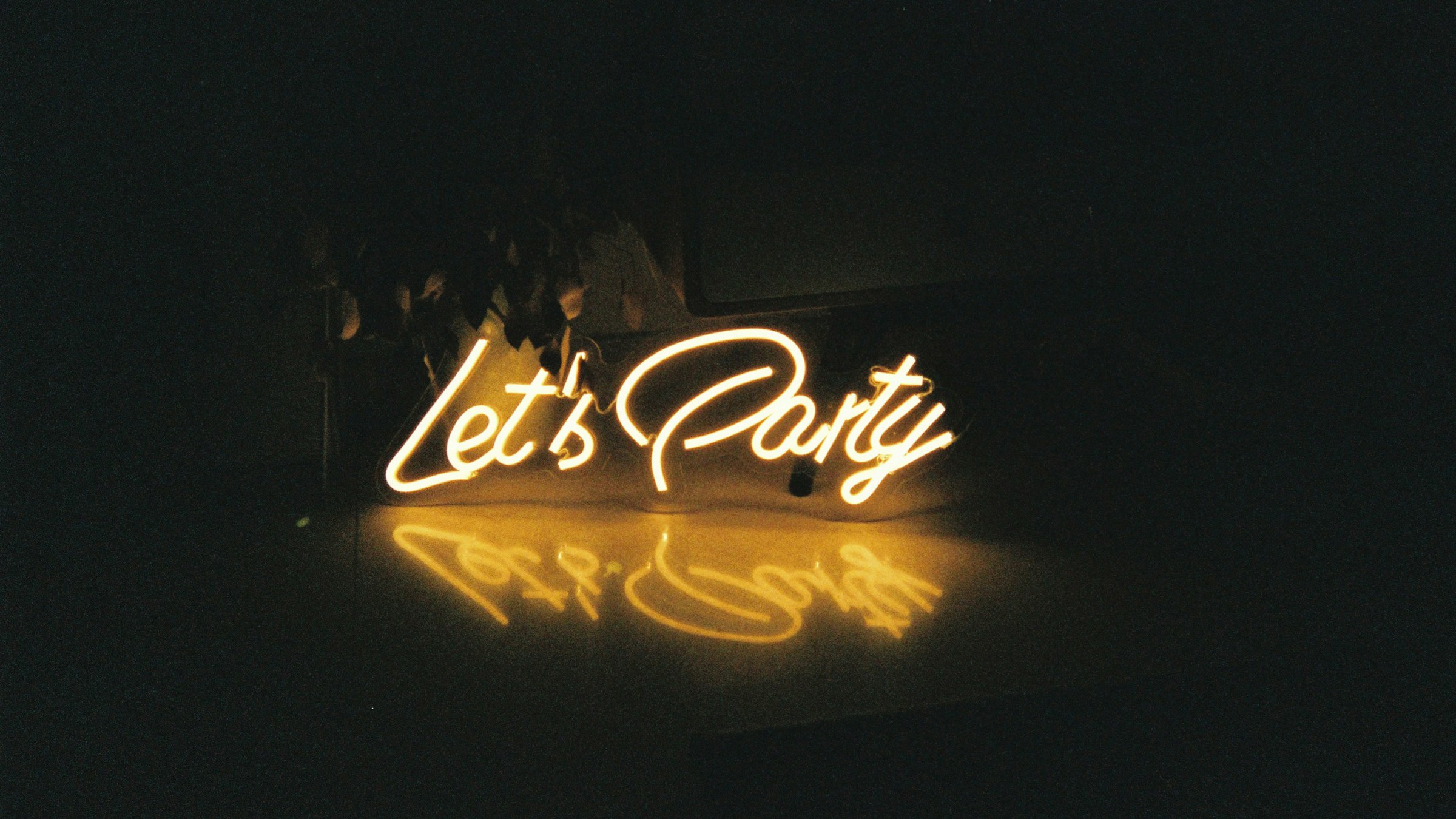 Neon Let's Party sign.