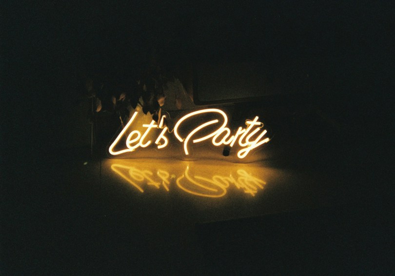 Neon Let's Party sign.