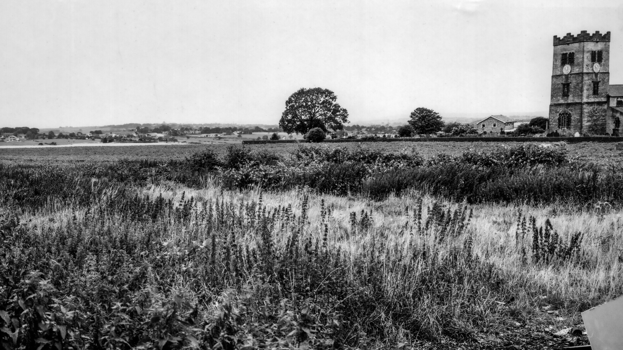 A photo showing the farmland with a view of St Paul’s Church, Drighlington.