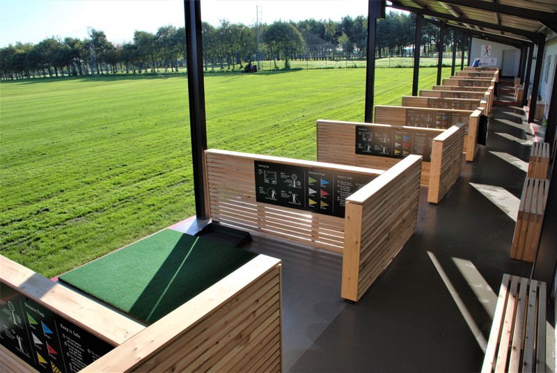 A view along the covered bays of the Driving Range at The Manor Leeds.