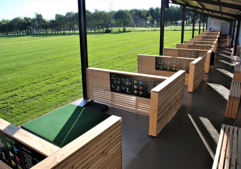 A view along the covered bays of the Driving Range at The Manor Leeds.