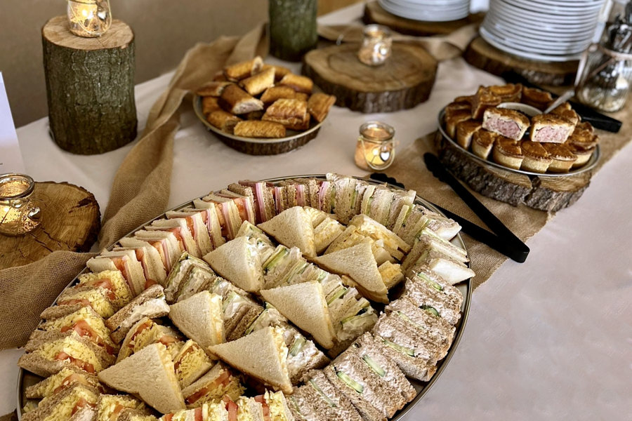 Sandwiches, pork pies and sausage rolls on a buffet table at The Manor Leeds.