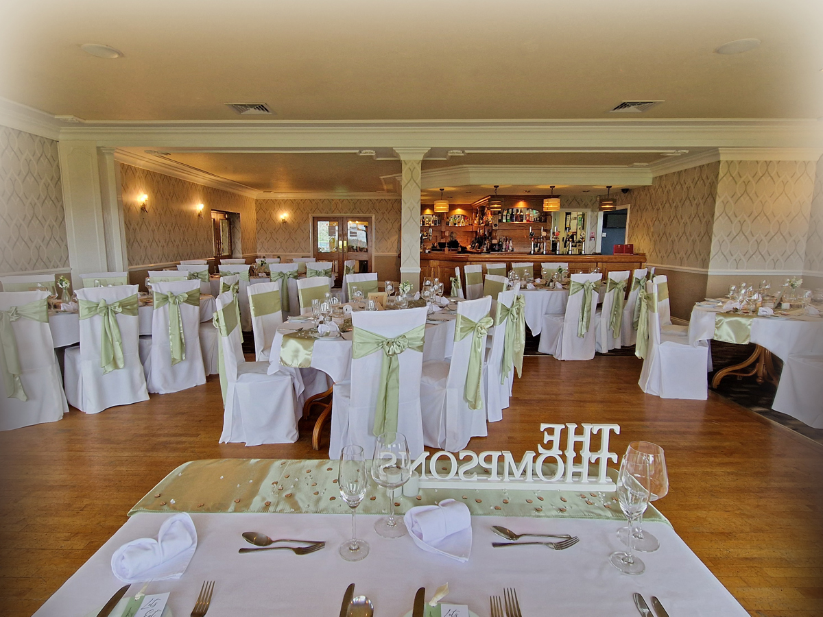 A view from a sweetheart table in The View towards the other dining tables set for a wedding breakfast. The bar can be seen in the background.