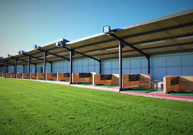 A view into the covered bays of the Driving Range at The Manor Leeds.