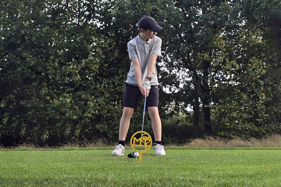 A junior golfer preparing to tee off from the 6th at The Manor Leeds.